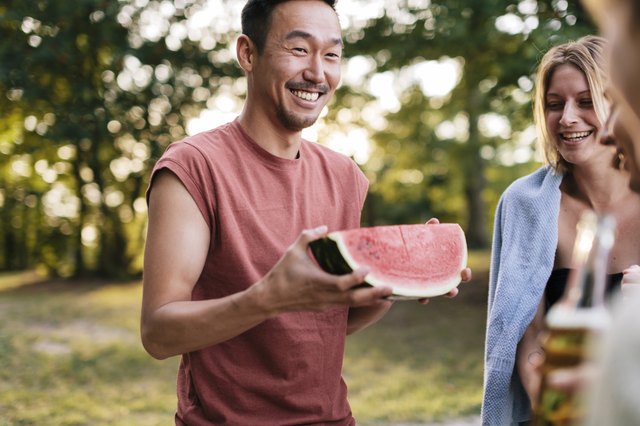 Young man with Watermelon at cookout