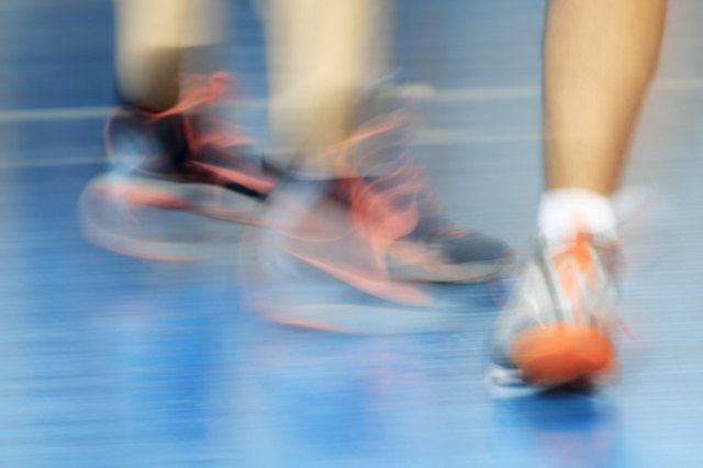 Blurred background with red laces of sneakers