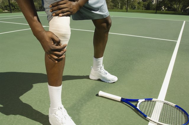 Tennis player with bandaged knee