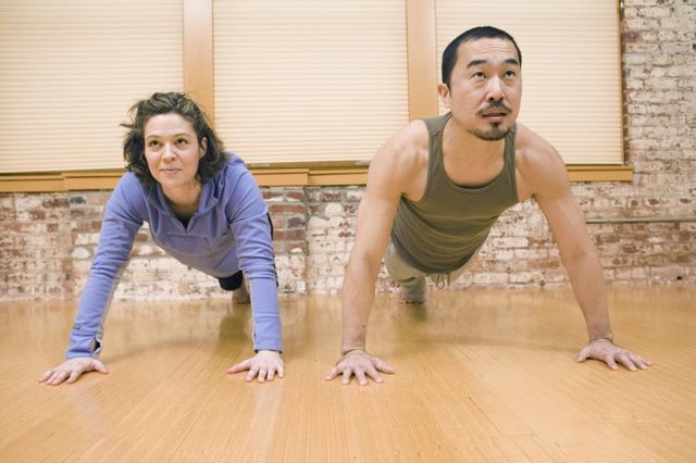 Young couple doing push-ups