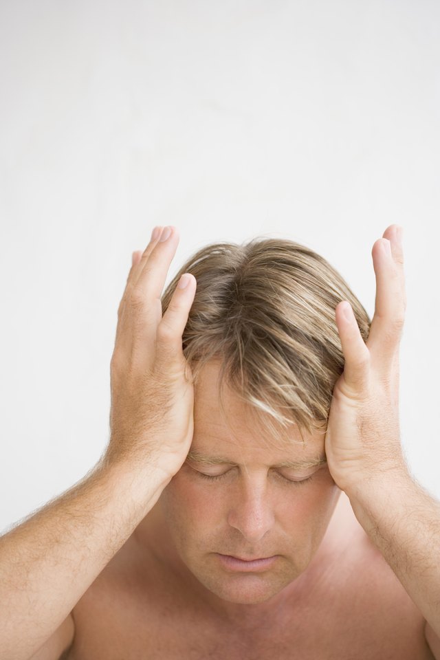 sharp pain back of head and nausea