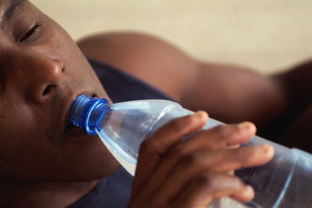 Man drinking bottled water, close-up