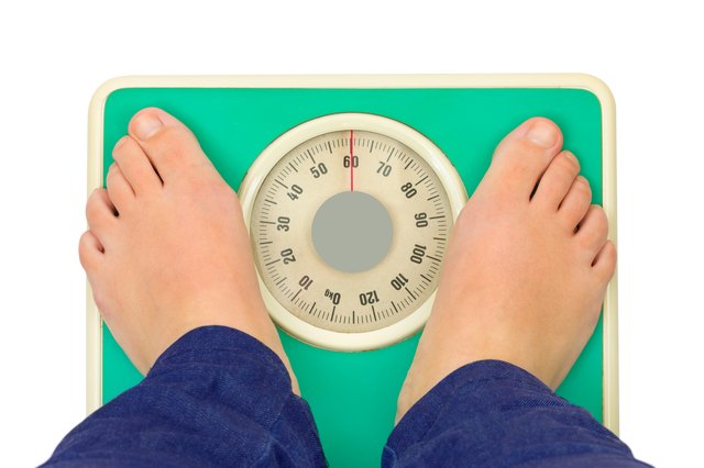 Woman feet and weight scale