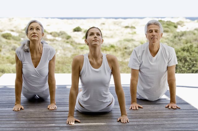 People exercising by beach