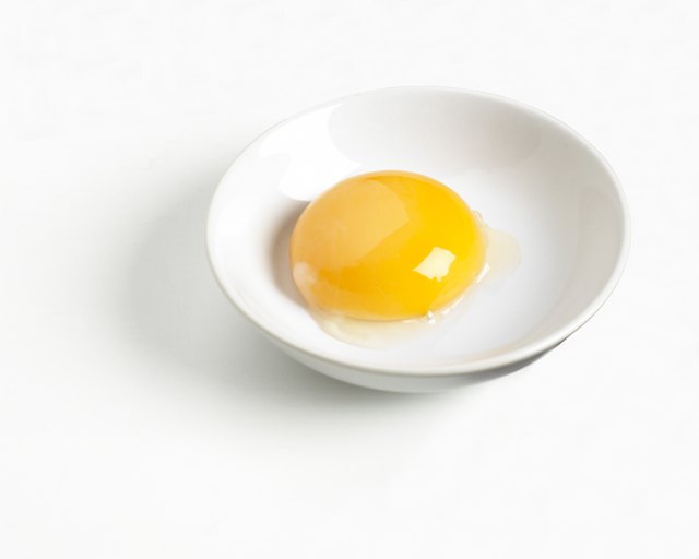 Egg yolk in a bowl, close up
