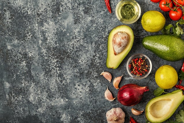 Fresh vegetables for cooking on dark background.