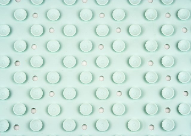 Suckers On The Back Of A Green Bathmat