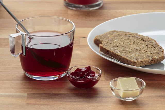 Strawberry tea, strawberry jam, butter and rye bread
