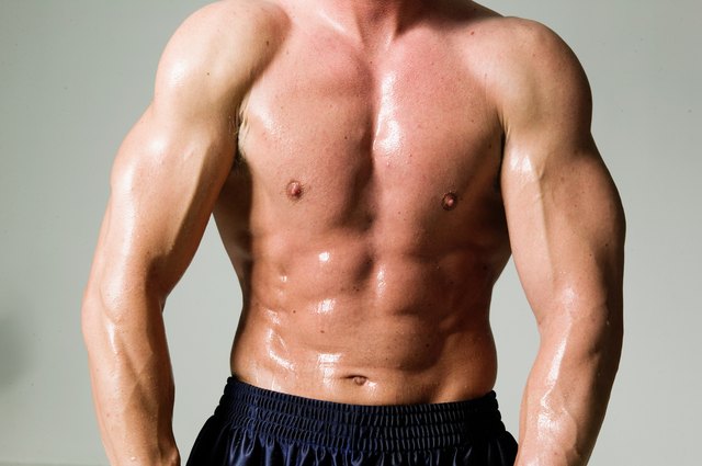 Man flexing muscles, mid section