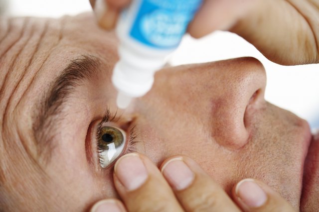 Man Applying Eye Drops