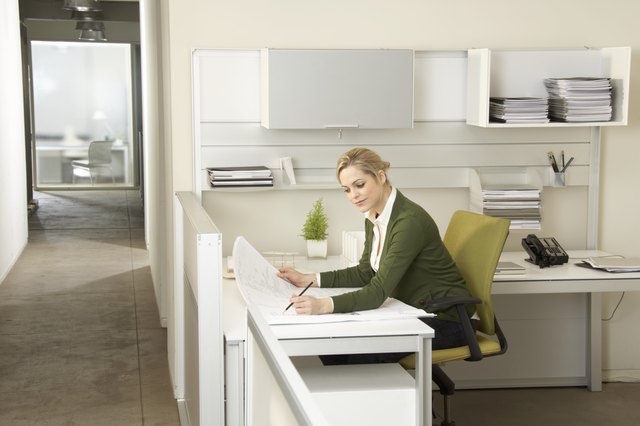 Young woman working at desk in office