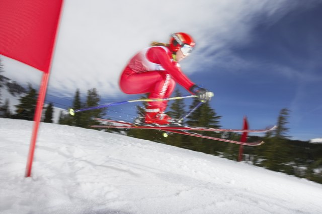Female skier in giant slalom ski race (blurred motion)