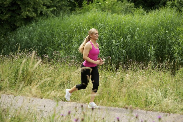 Healthy young woman exercising outdoors
