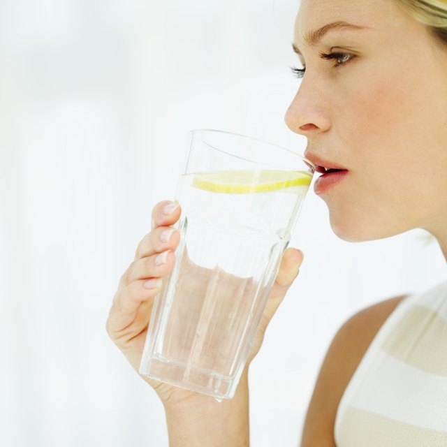 woman drinking a glass of water