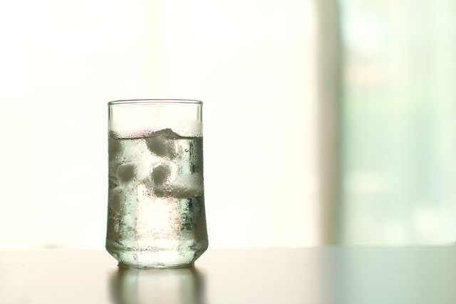 glass of Cool fresh drink with ice cube