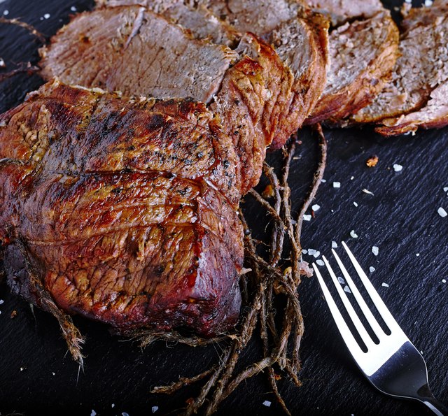 Roast beef on black stone board