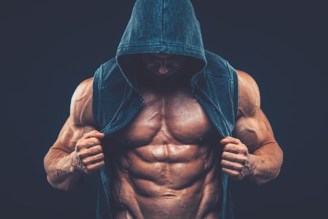 Man with muscular torso. Strong Athletic Man Fitness Model Torso showing six pack abs fighter kickbox boxer boxing fight