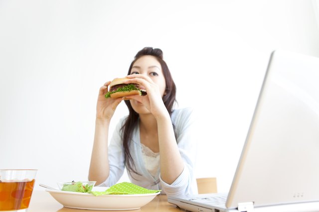 Young woman eating a hamburger