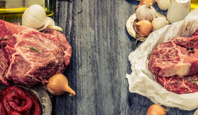 Raw fresh marbled meat on rustic wooden background, banner