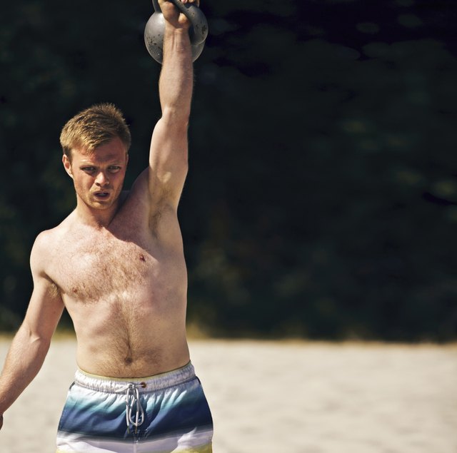 Guy Lifting Heavy Kettlebell