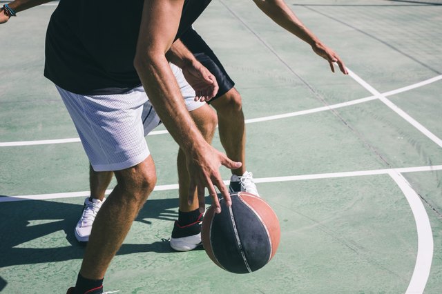 Men playing basketball