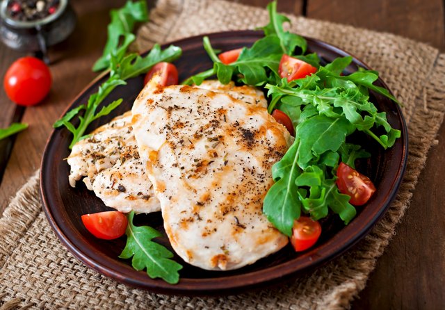 Chicken breast with fresh salad - arugula and tomato