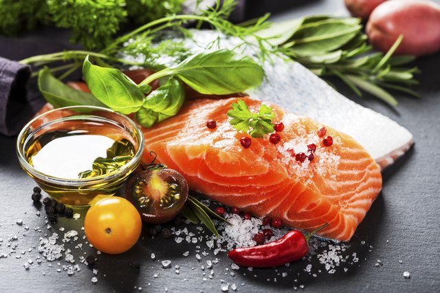 Delicious portion of fresh salmon fillet with aromatic herbs,