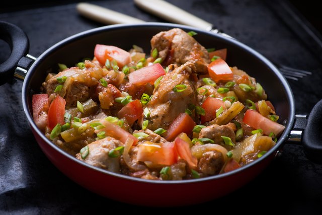 Chicken stew with onion, pepper ant tomato