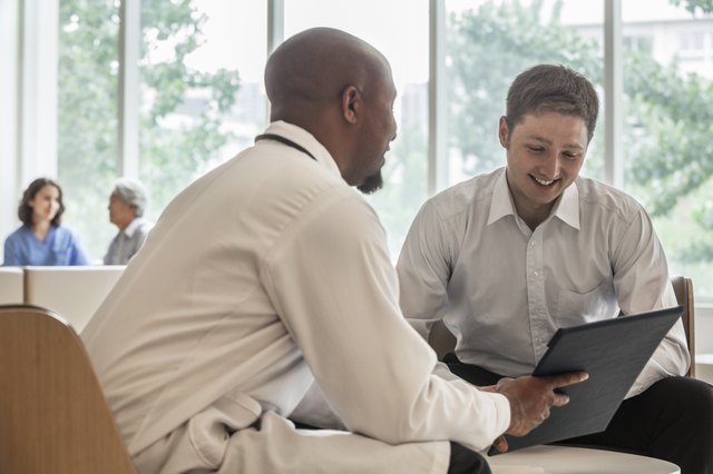 Doctor and patient discussing medical record in the hospital