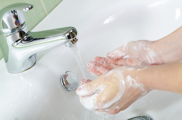 Woman washing her hands
