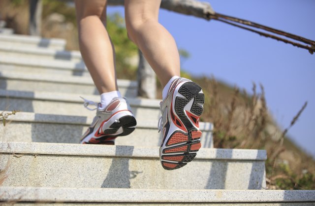 woman running up on mountain stairs