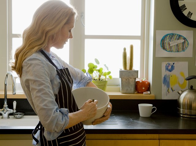 Woman holding mixing bowl