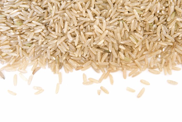 Border of long grain brown rice on white