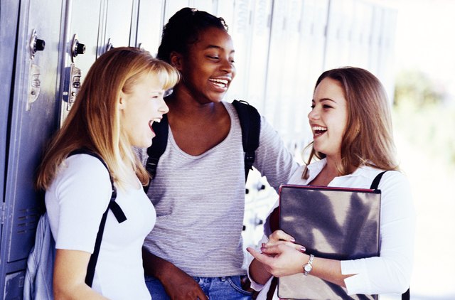 Teenage girls by lockers