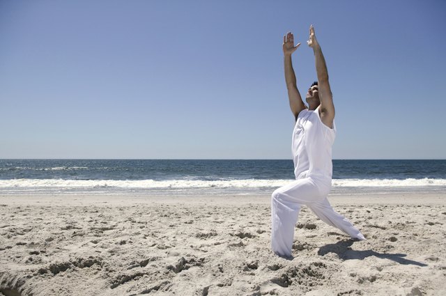 Man stretching on beach