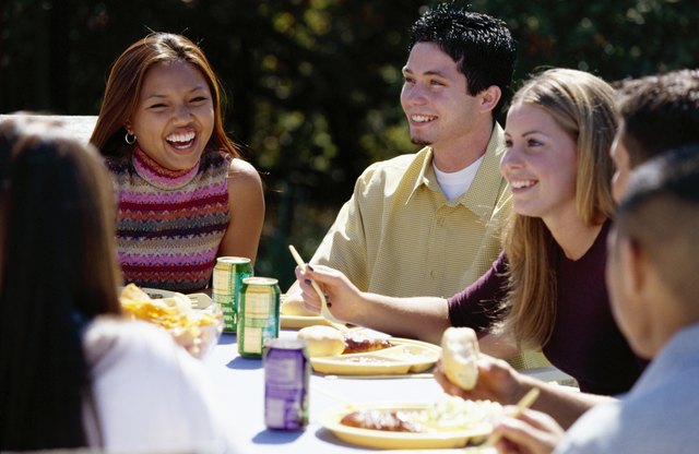Friends eating lunch outdoors
