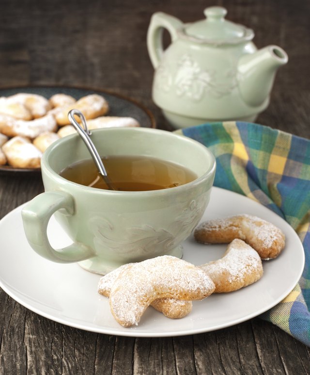 Crescents vanilla almond cookies and cup of green tea