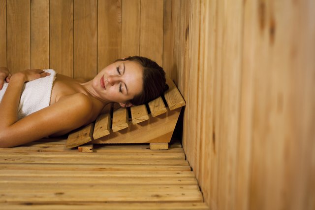 Young woman relaxing in a sauna