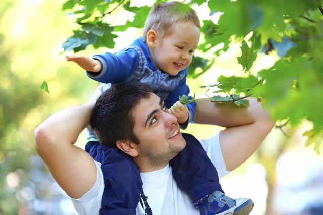 father and son having fun playing outdoors