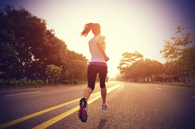 healthy lifestyle fitness sports woman running on road