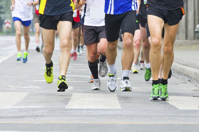 People running in city marathon