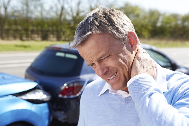 Driver Suffering From Whiplash After Traffic Collision