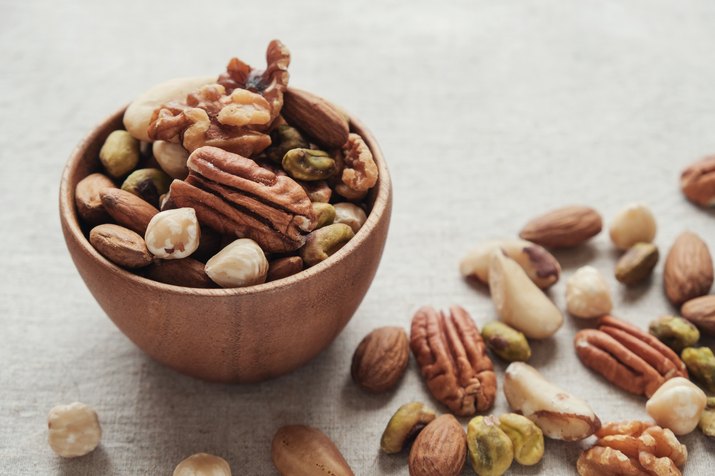 Mixed healthiest nuts in wooden bowl