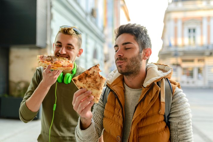 Male Friends Having Pizza