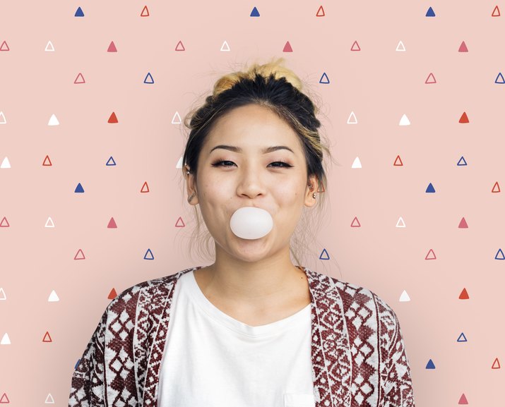 Young Girl Chewing Bubble Gum Concept