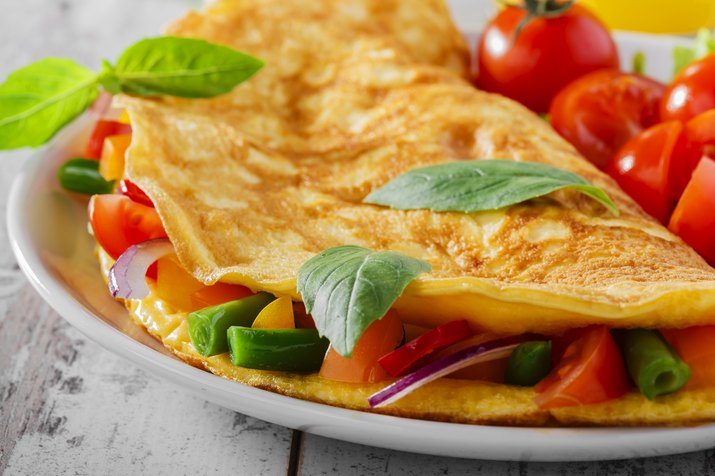 Omelet with vegetables and cherry tomatoes
