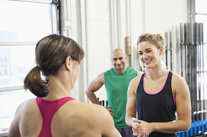 People talking at a CrossFit box