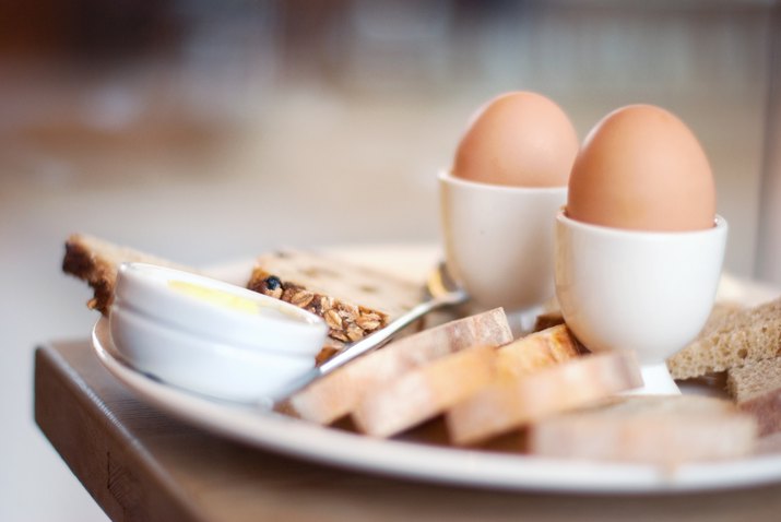 Boiled eggs and bread in plate
