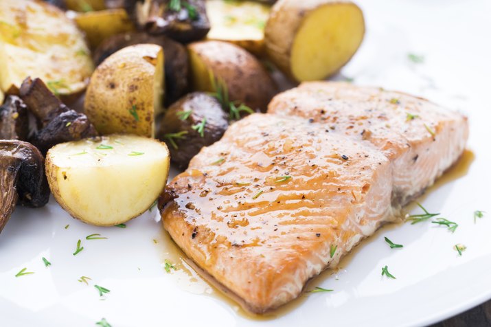 Roasted salmon with potatoes and mushrooms