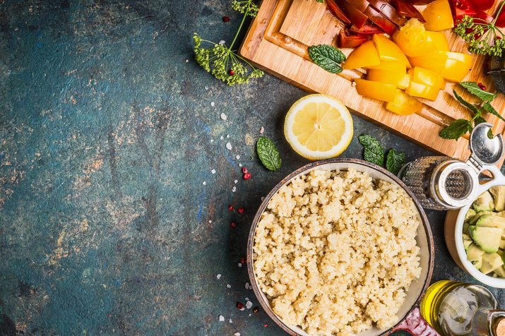 Cooked Quinoa with chopped vegetarian ingredients, top view